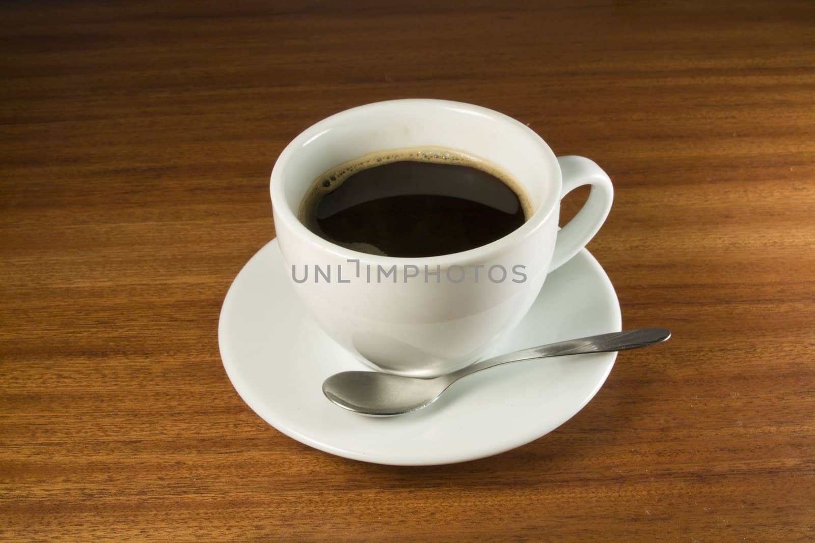 Coffeecup with Coffee in it on a wooden table 1 by smoki