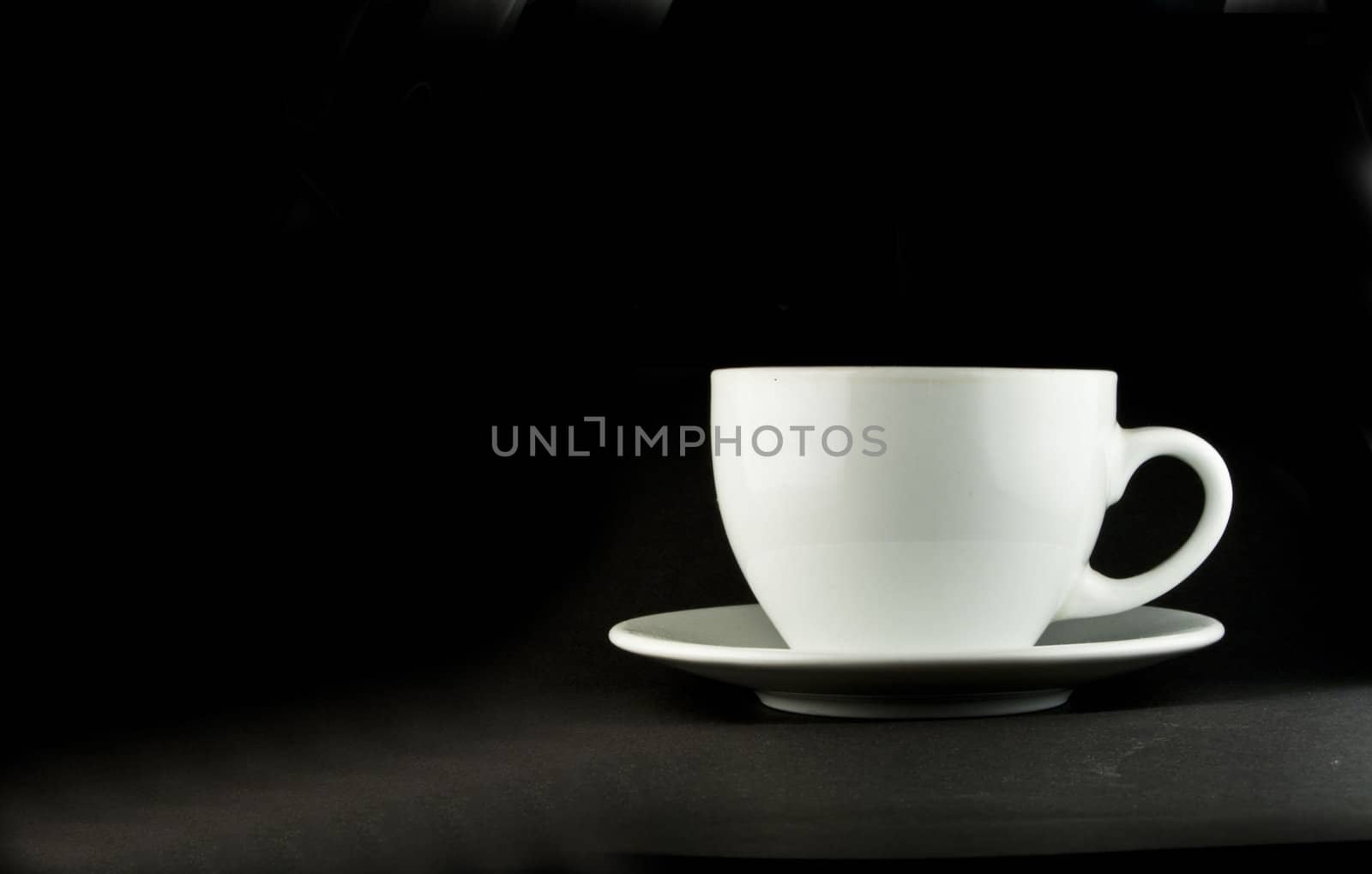 Perfect white coffee cup on a black background