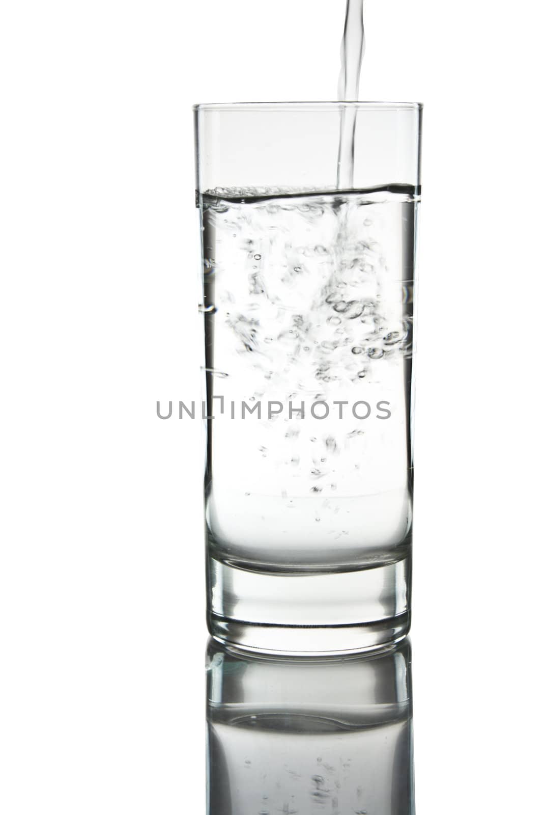 mineral water being poured into a glass