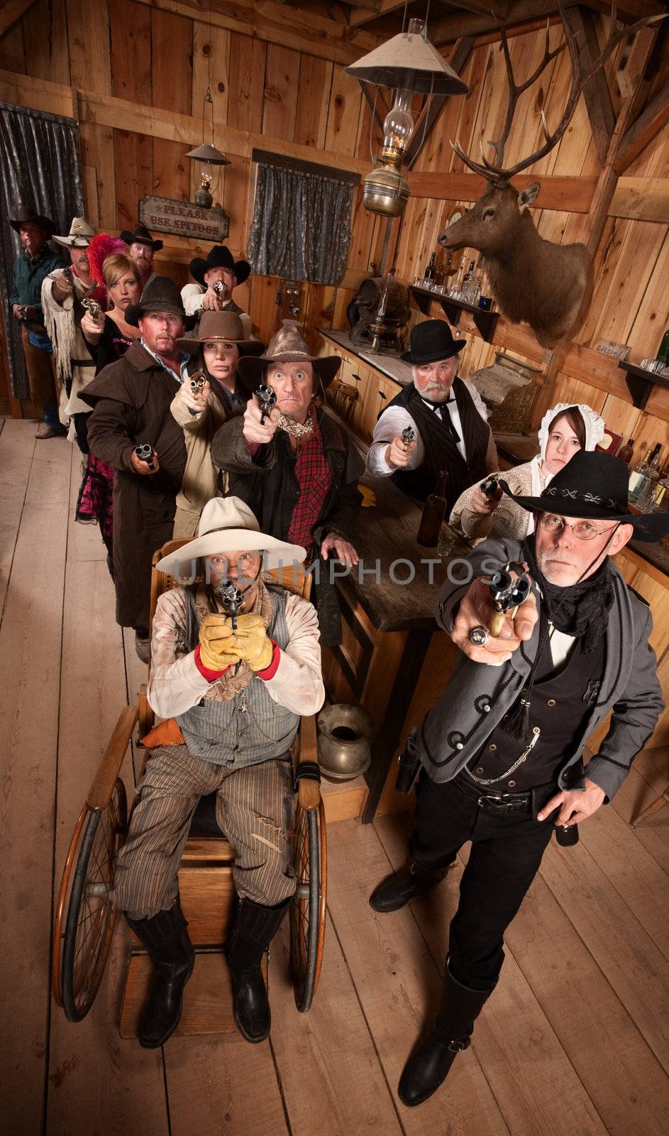 Serious people in old west saloon pull out their weapons