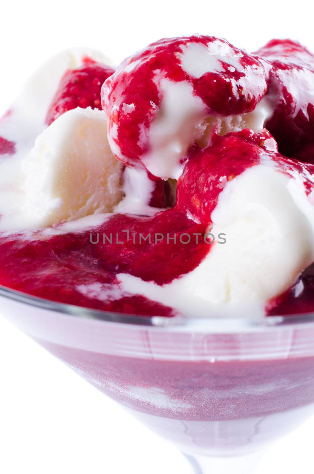 Ice cream and jam in glass isolated close up