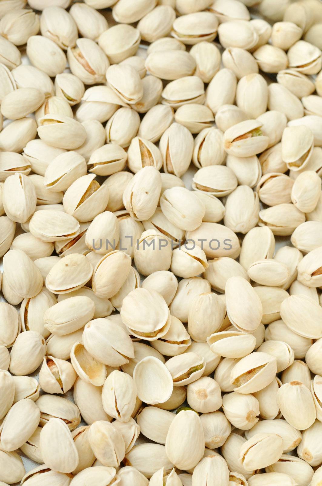 Pistachio Nuts Snack Pieces as a Big Pile