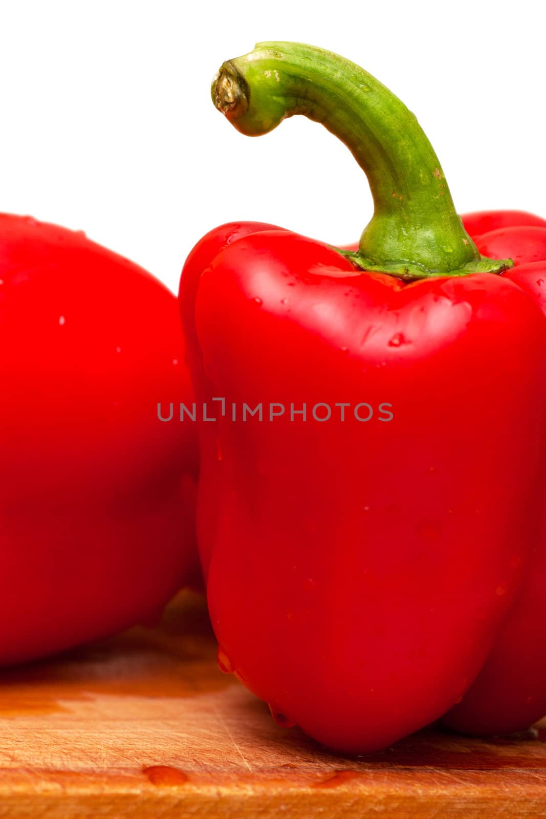 Sweet red peppers over white background