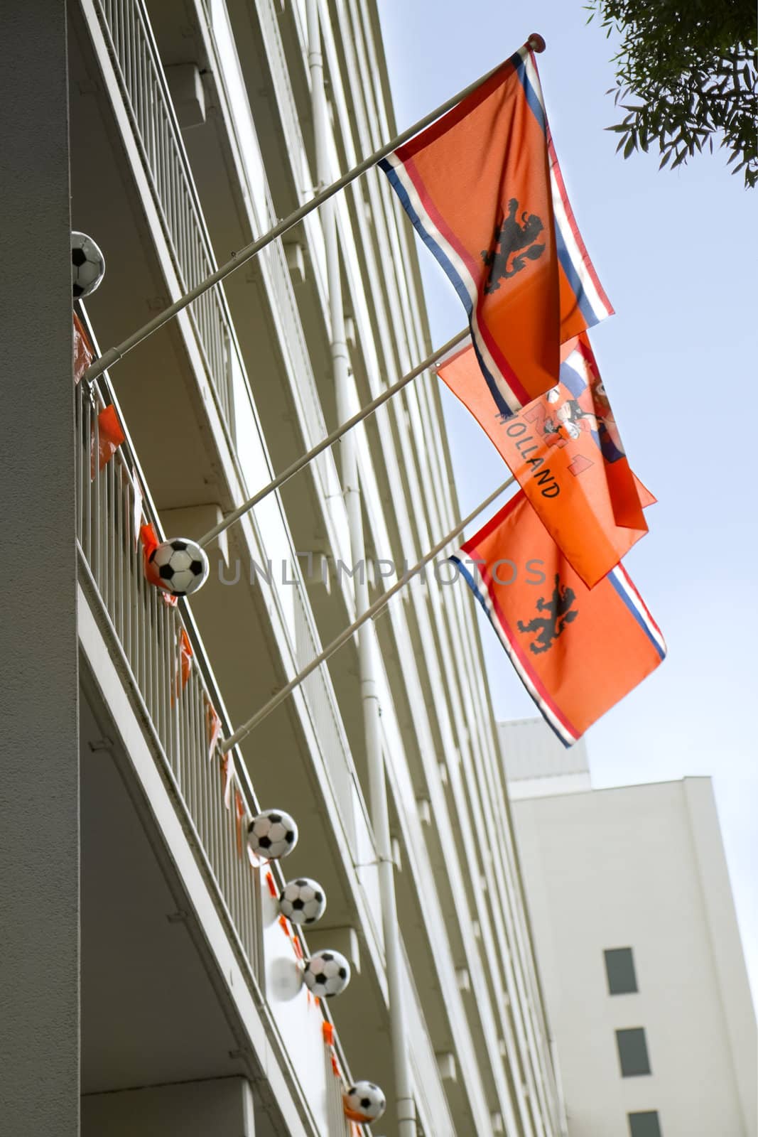 THE NETHERLANDS - 2012: Support of the Dutch team in the cities during soccer- or football championships, decorated appartmenthouse, June 2012, the Netherlands