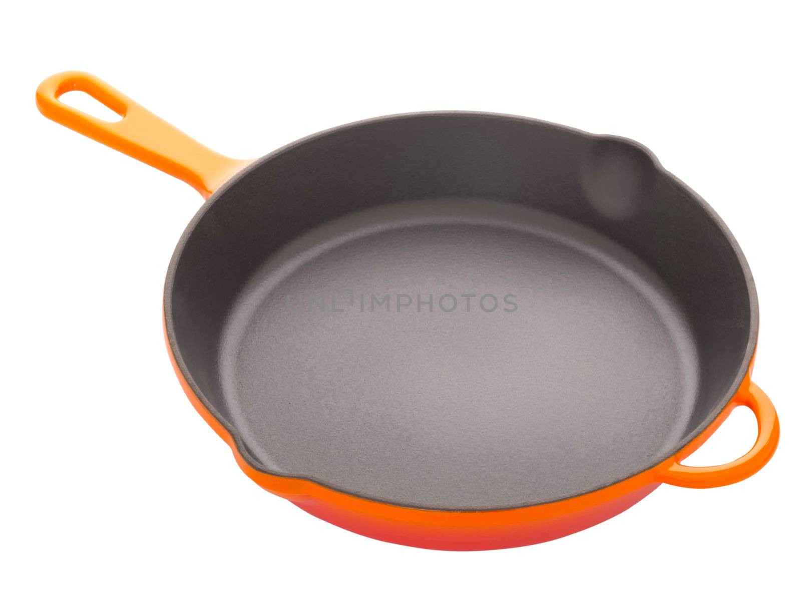 close up of a cast iron pan isolated on white