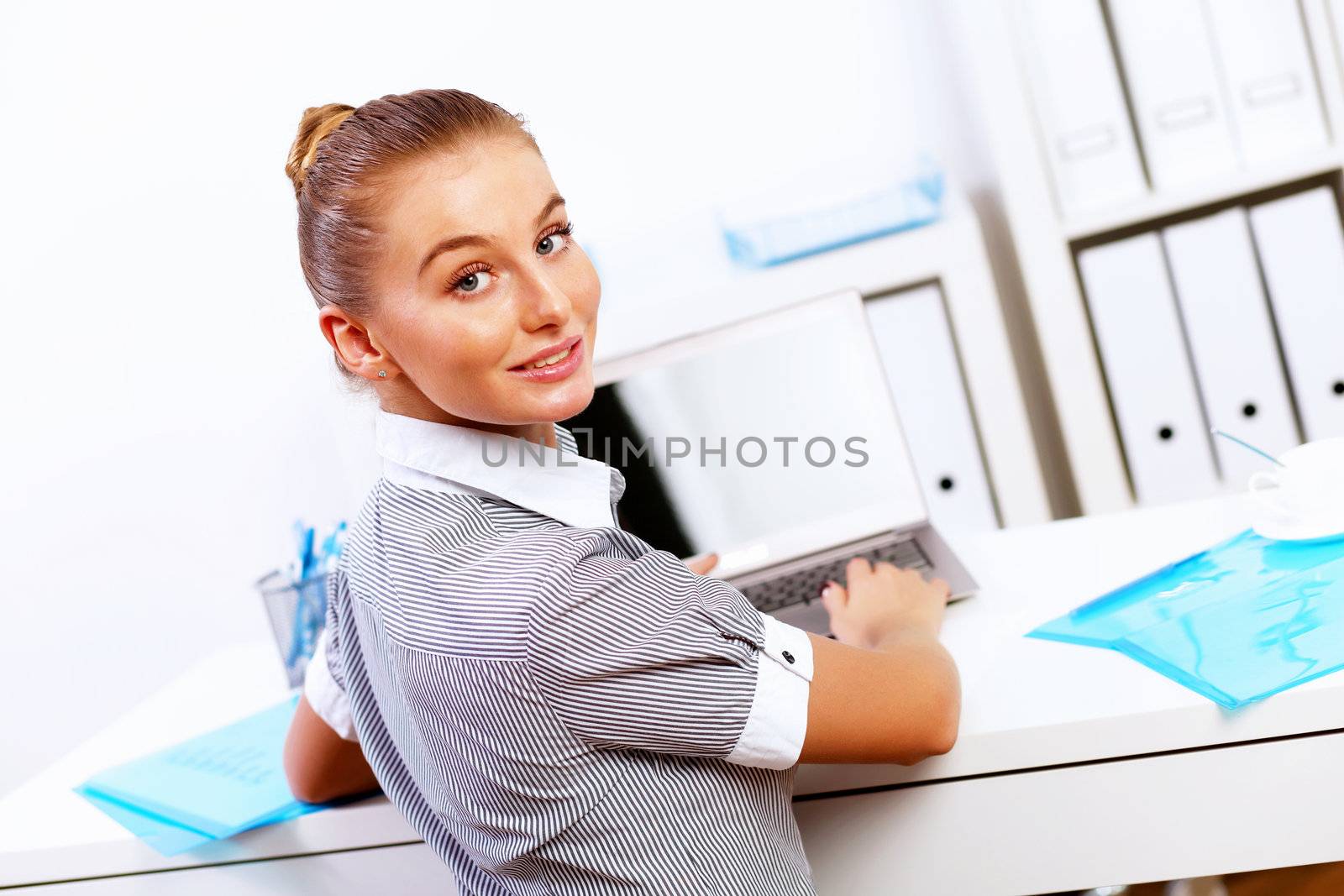 Business woman working on computer in office