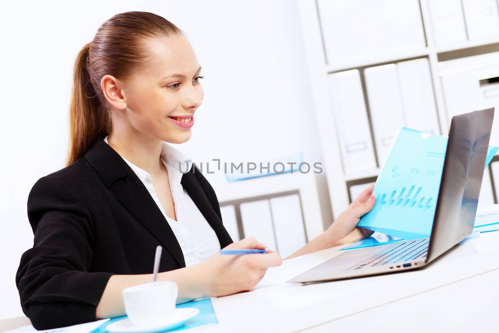 Business woman working on computer in office