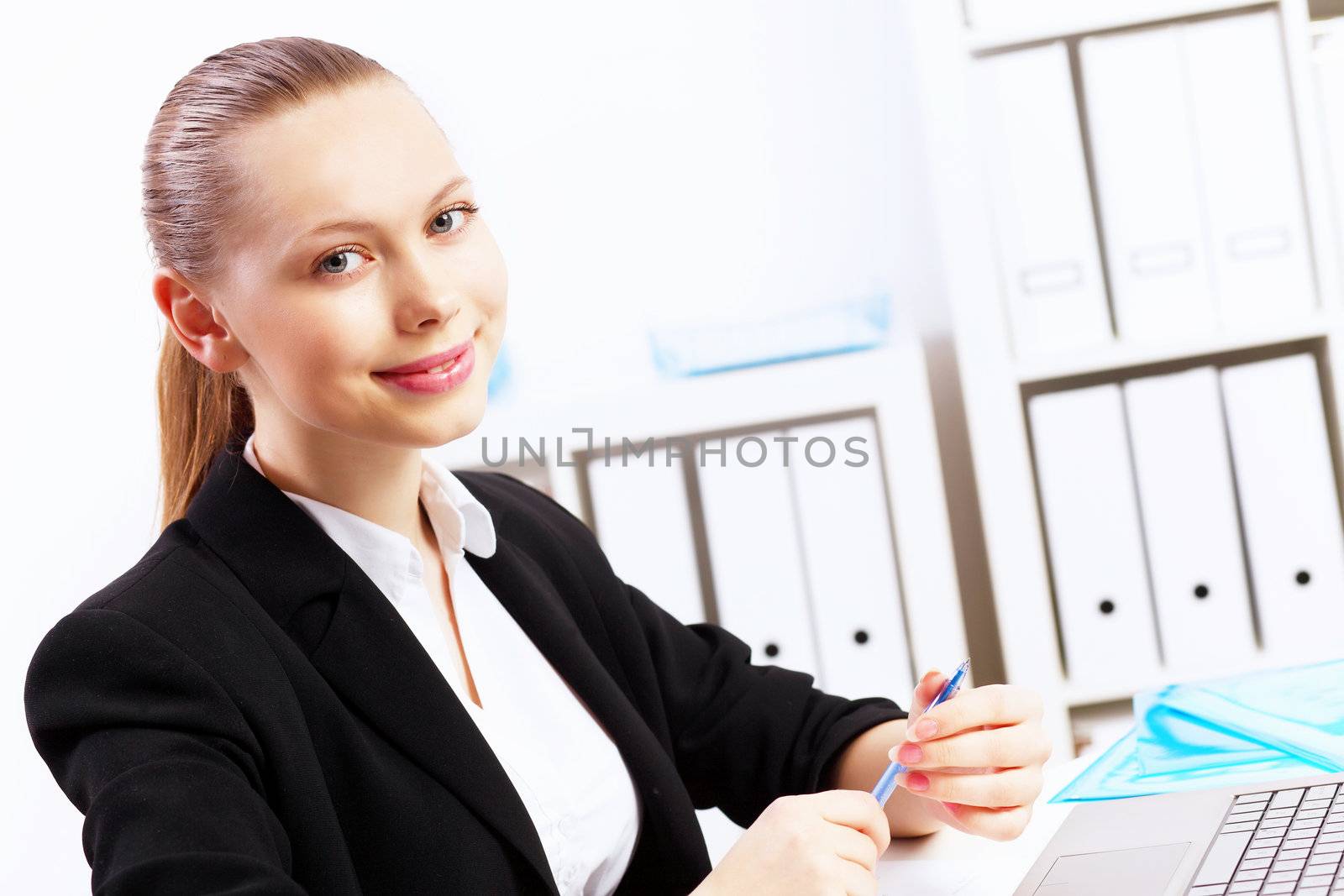 Business woman working on computer in office