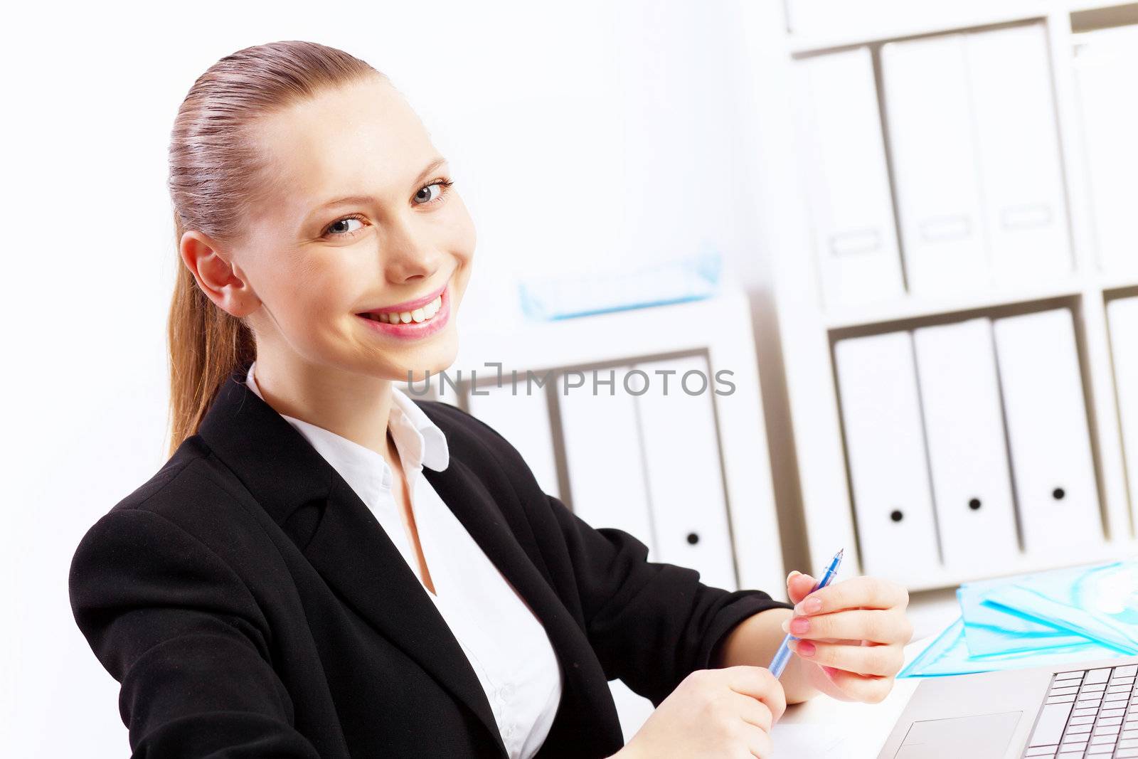 Business woman working on computer in office