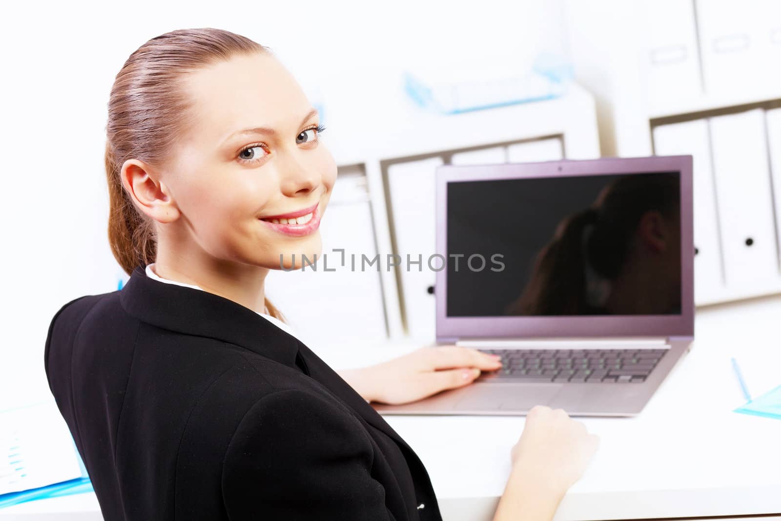 Business woman working on computer in office