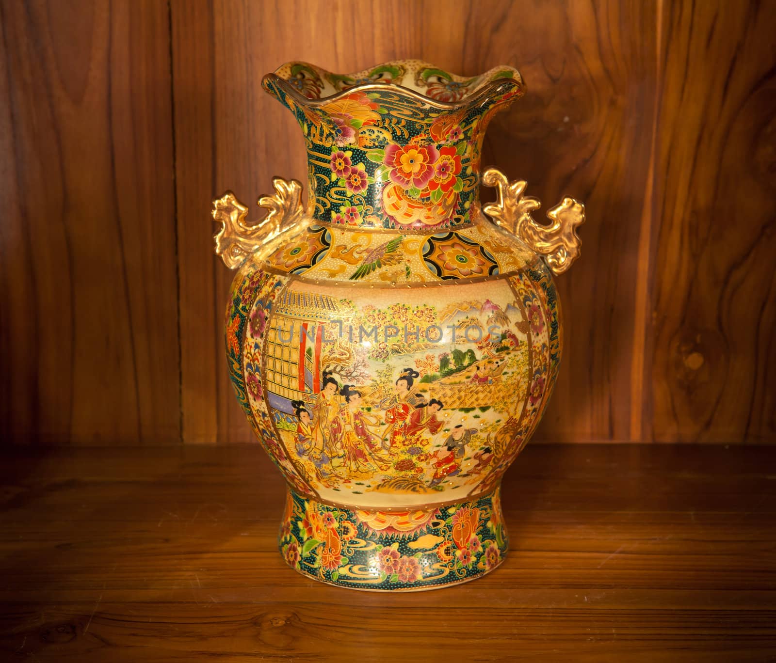 Chine vase gold on the wood background