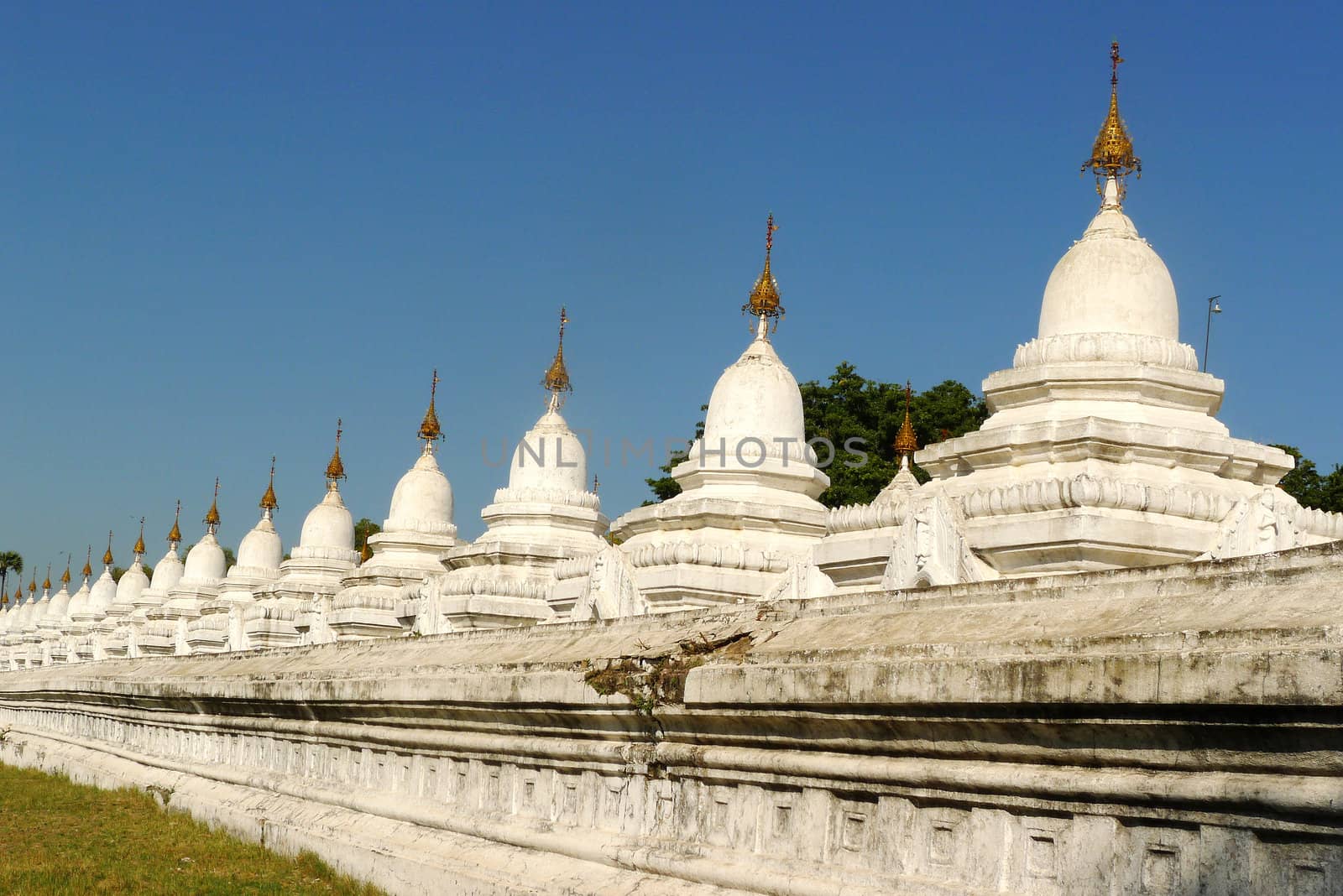 Row of historic white buddhist stupa in Myanmar