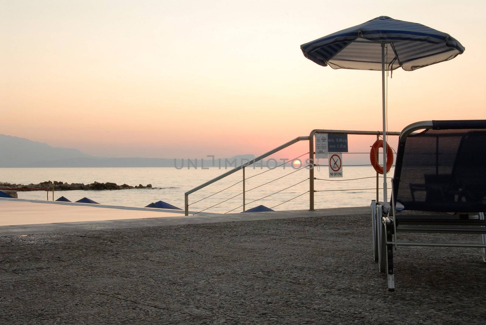 Solitary shore and romantic sunset