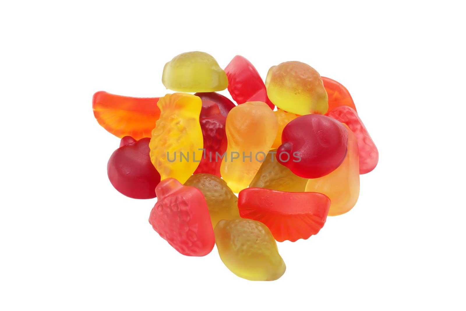 assortment of jelly beans with shape and flavor to fruits cut and isolated
