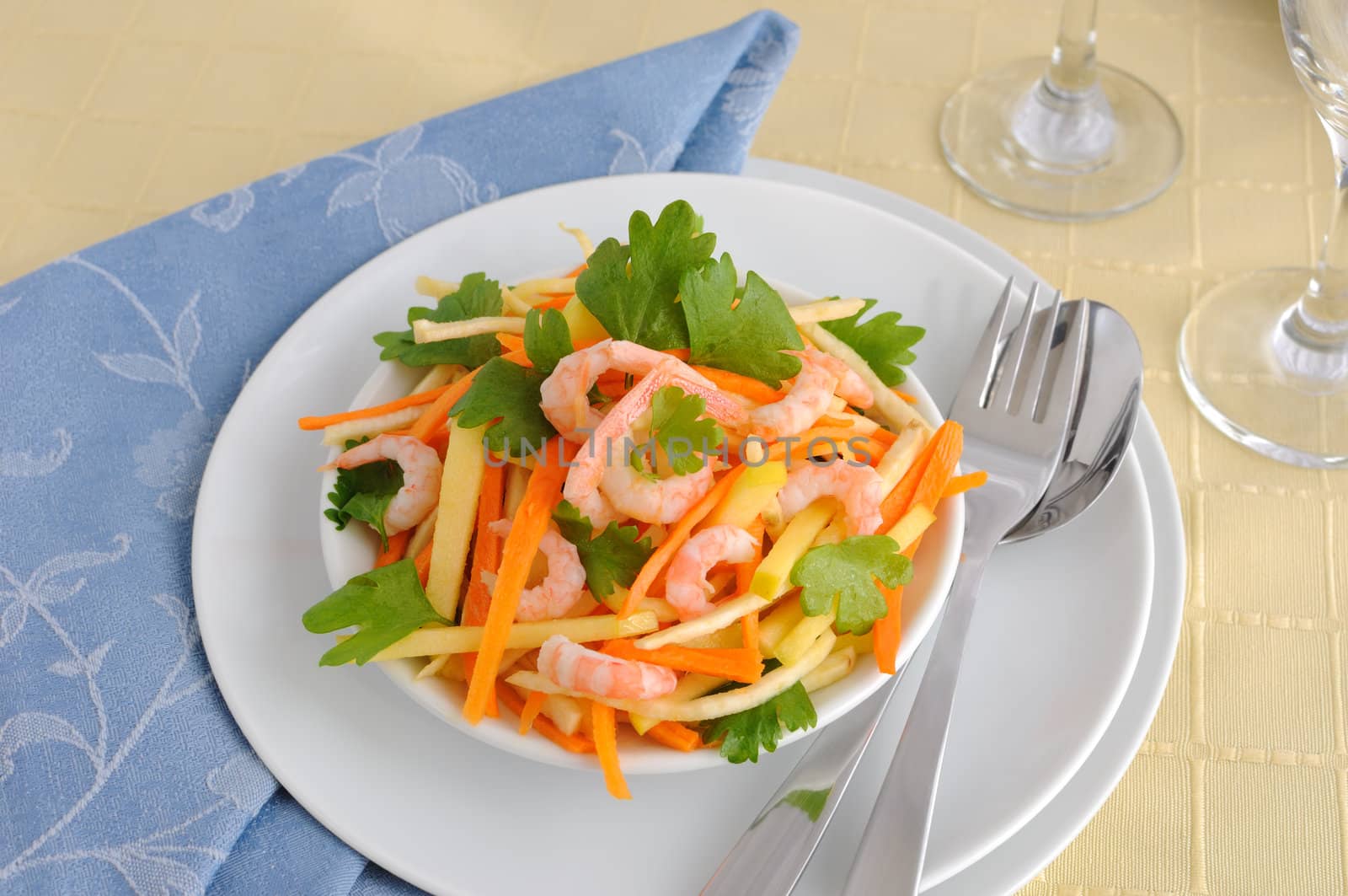 Salad of celery root and leaves with carrots, apples and shrimp