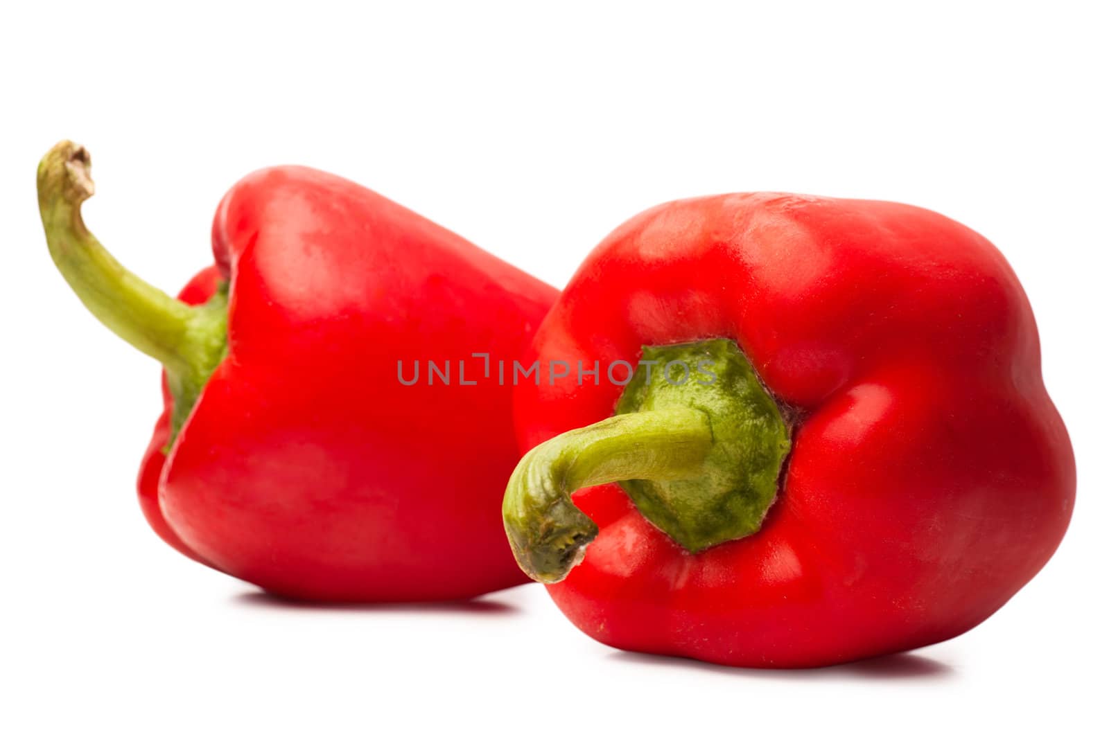 Sweet red peppers over white background