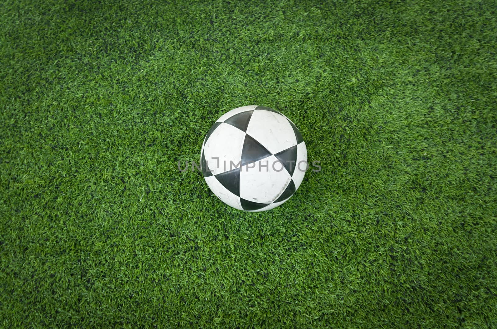 Black and white soccer ball on Artificial turf football field