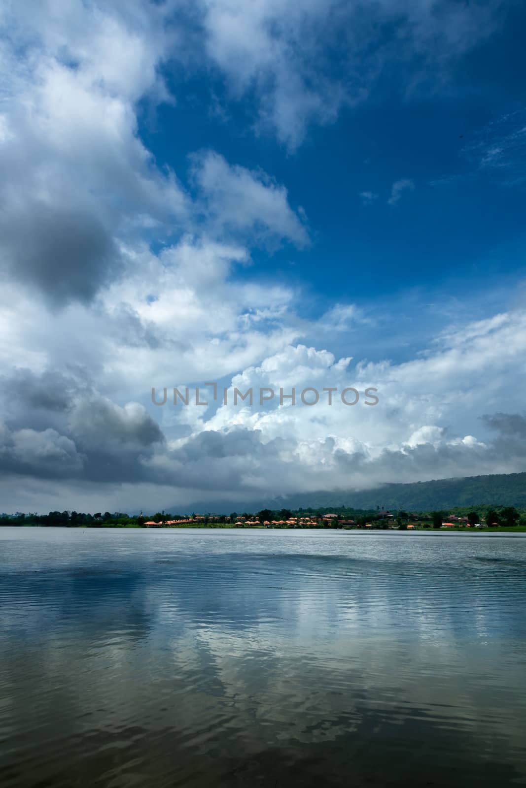 Dense cloud in the sky and the reflection on the water