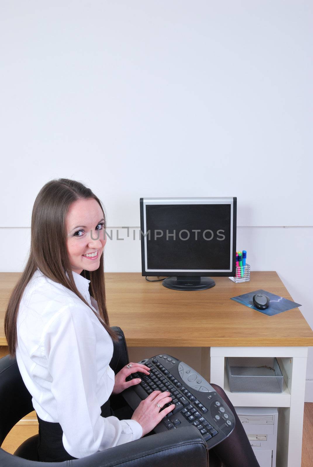Business woman with keyboard on lap