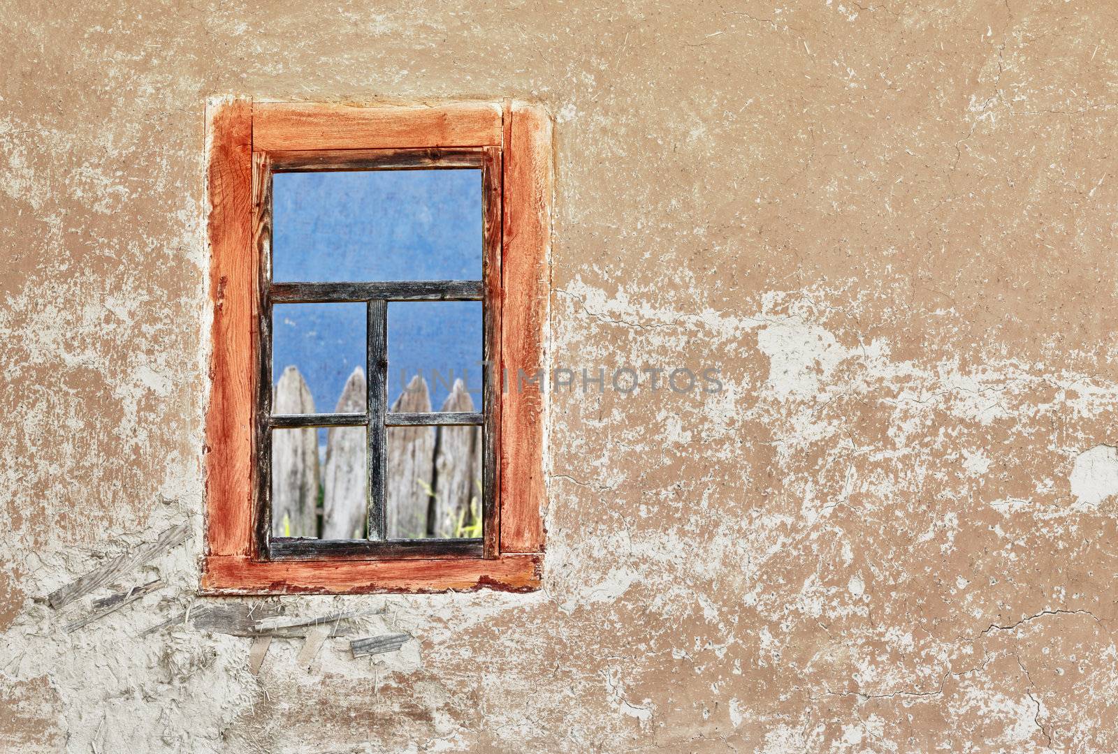 The wall of ancient Ukrainian house with a window