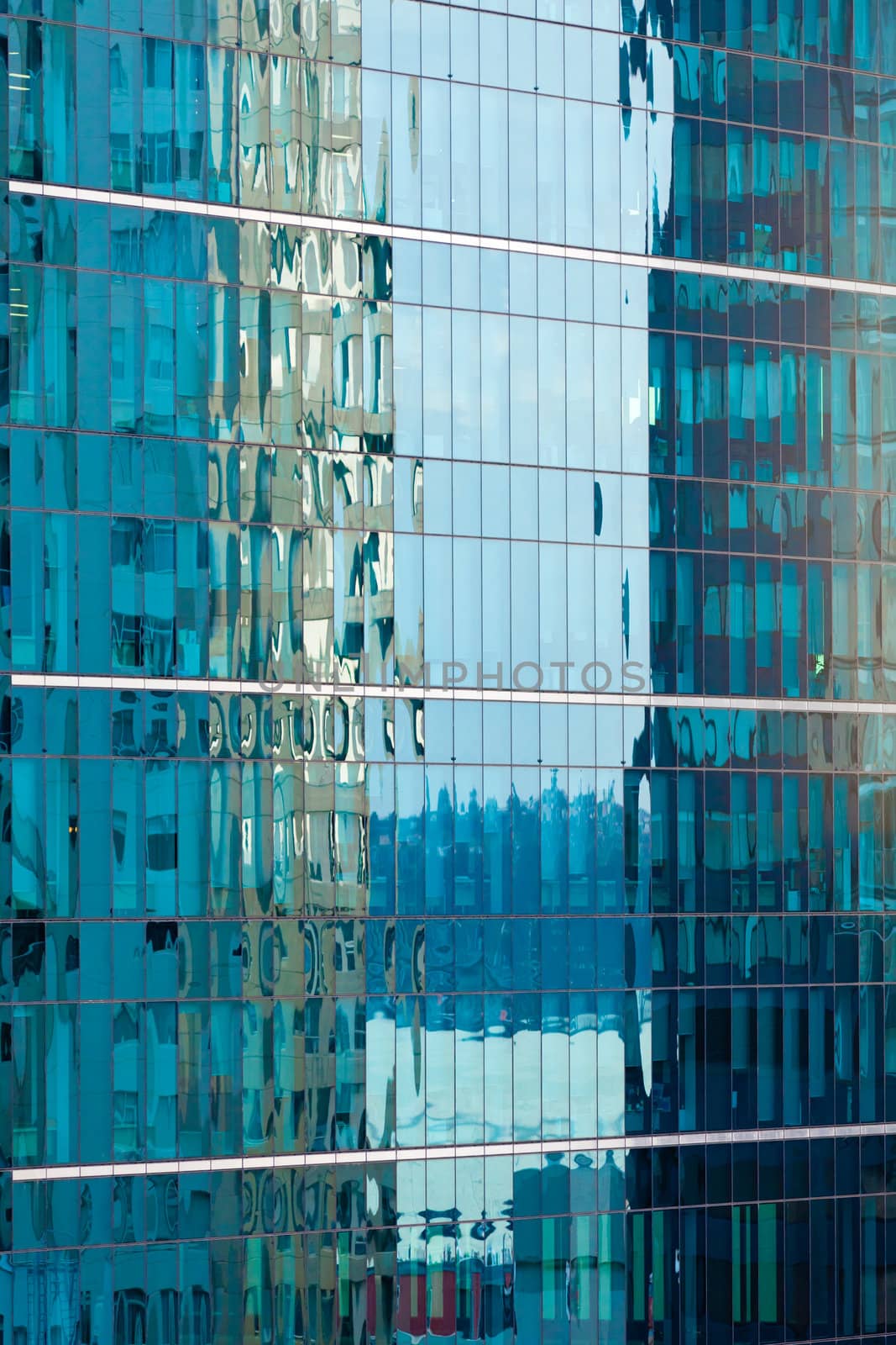 Background of beautiful blue reflections with a rippled effect in a modern coporate glass-walled building facade