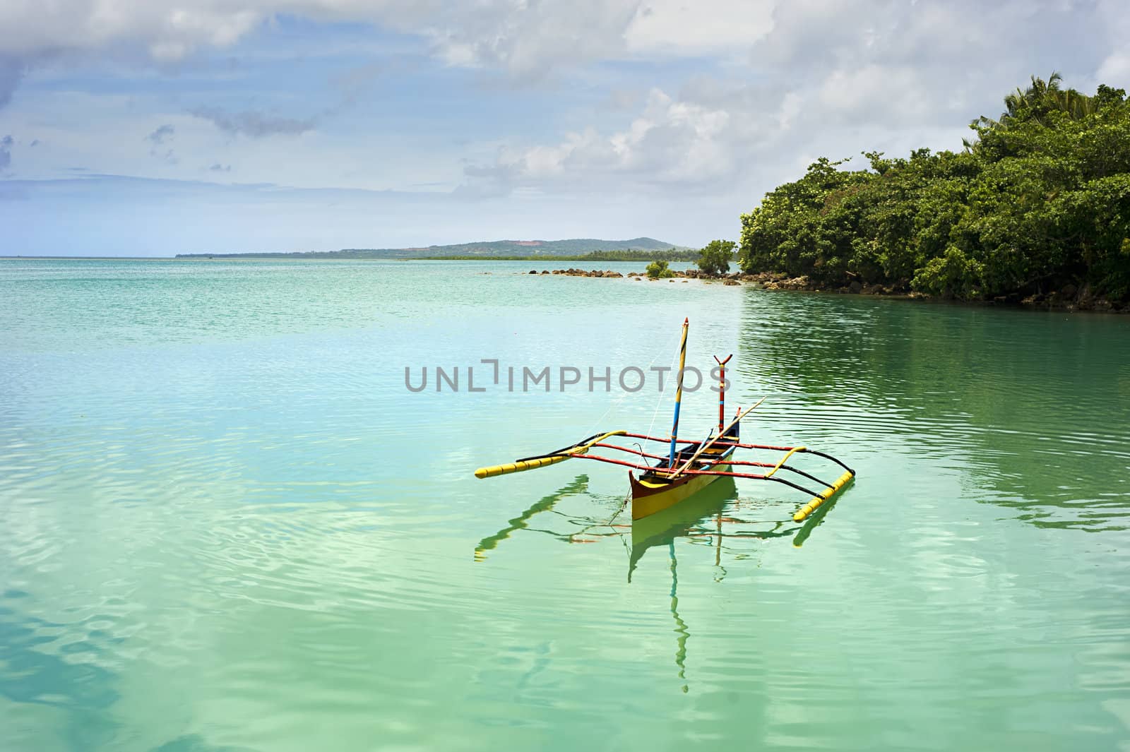 Tropical landscape with traditional Philippines boat on Calicoan island, Philippines