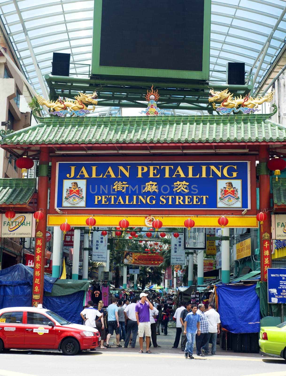 Kuala Lumpur, Malaysia - March 20, 2011: Petaling Street in Kuala Lumpur . The street is a long market which specialises in counterfeit clothes, watches and shoes. Famous tourist attraction