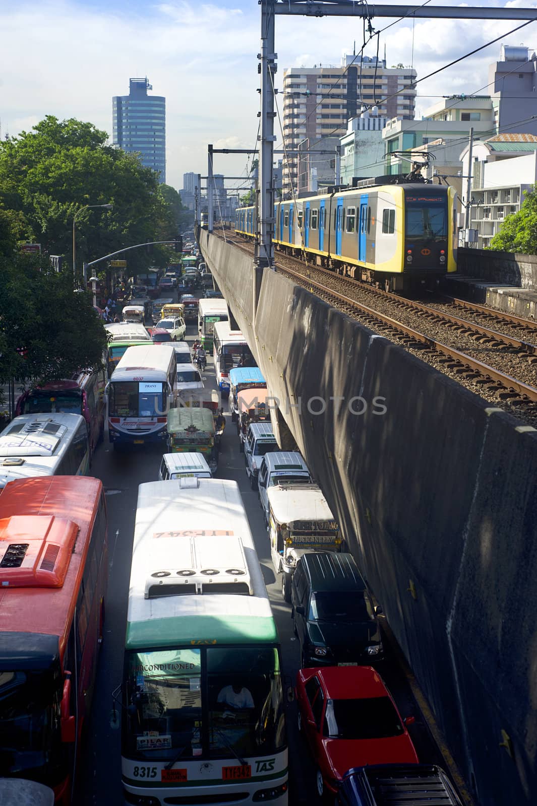 Manila, Philippines - April 02, 2012: LRT train arrives at a train station. LRT serves 579,000 passengers each day. Its 31 stations along over 31 kilometers (19 mi) of mostly elevated track form two lines