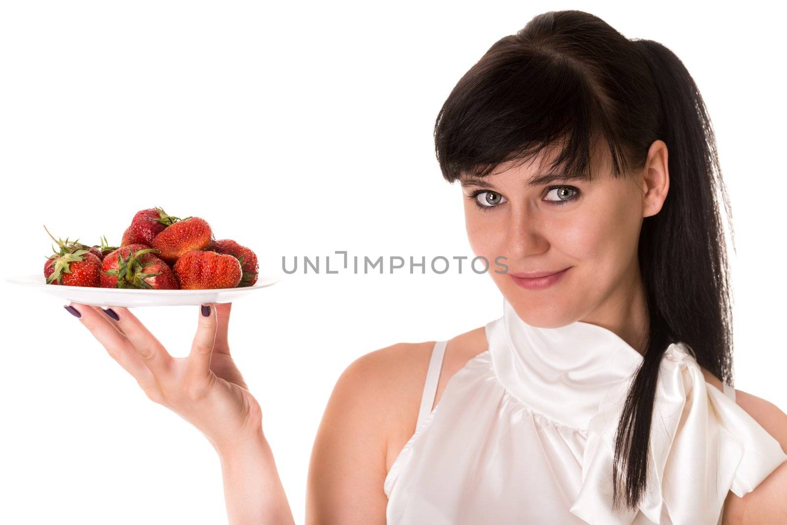 Playful woman with strawberries on plate by iryna_rasko