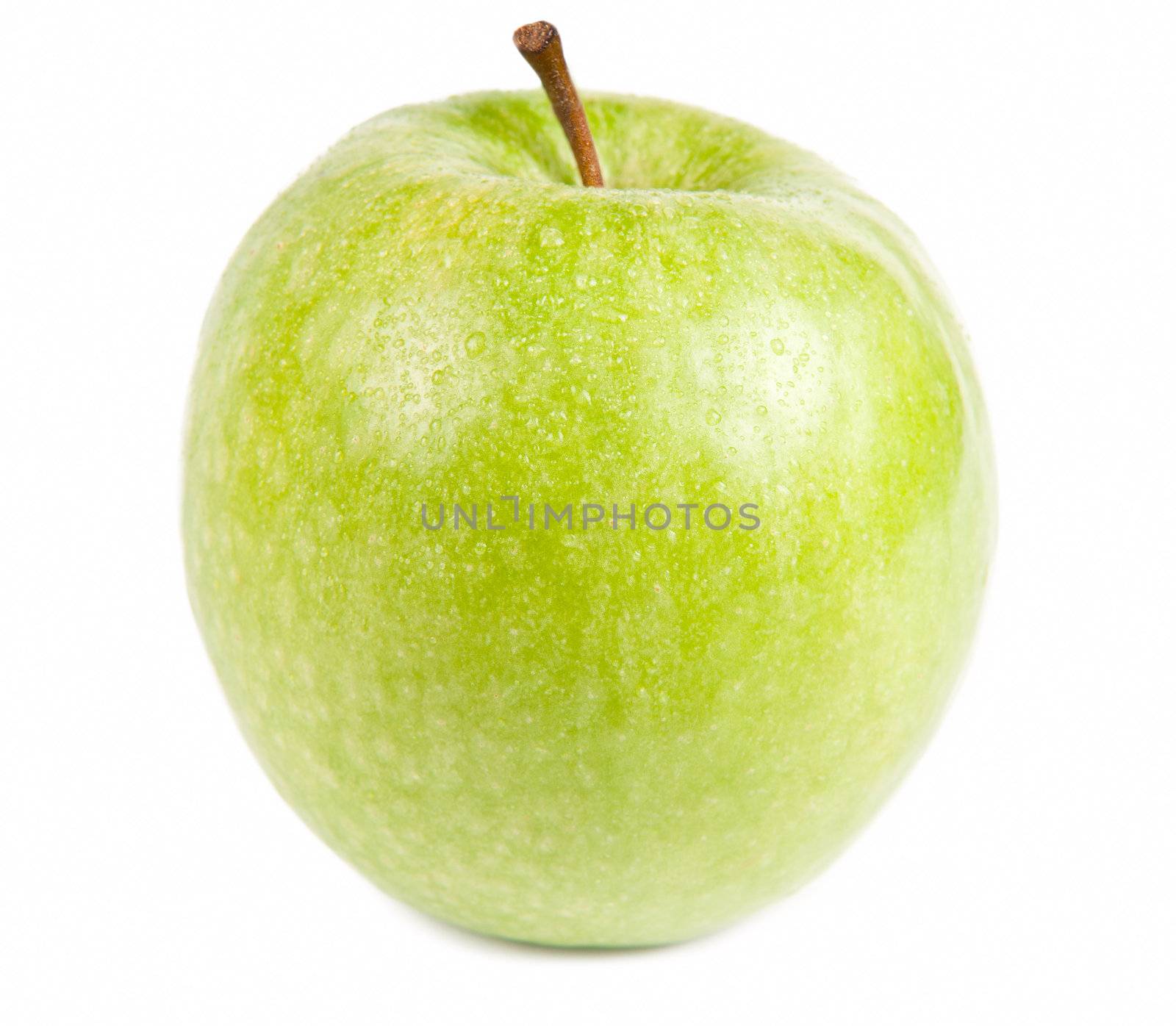 Isolated frontal shot of a fresh green apple with stem and drops of water on it.