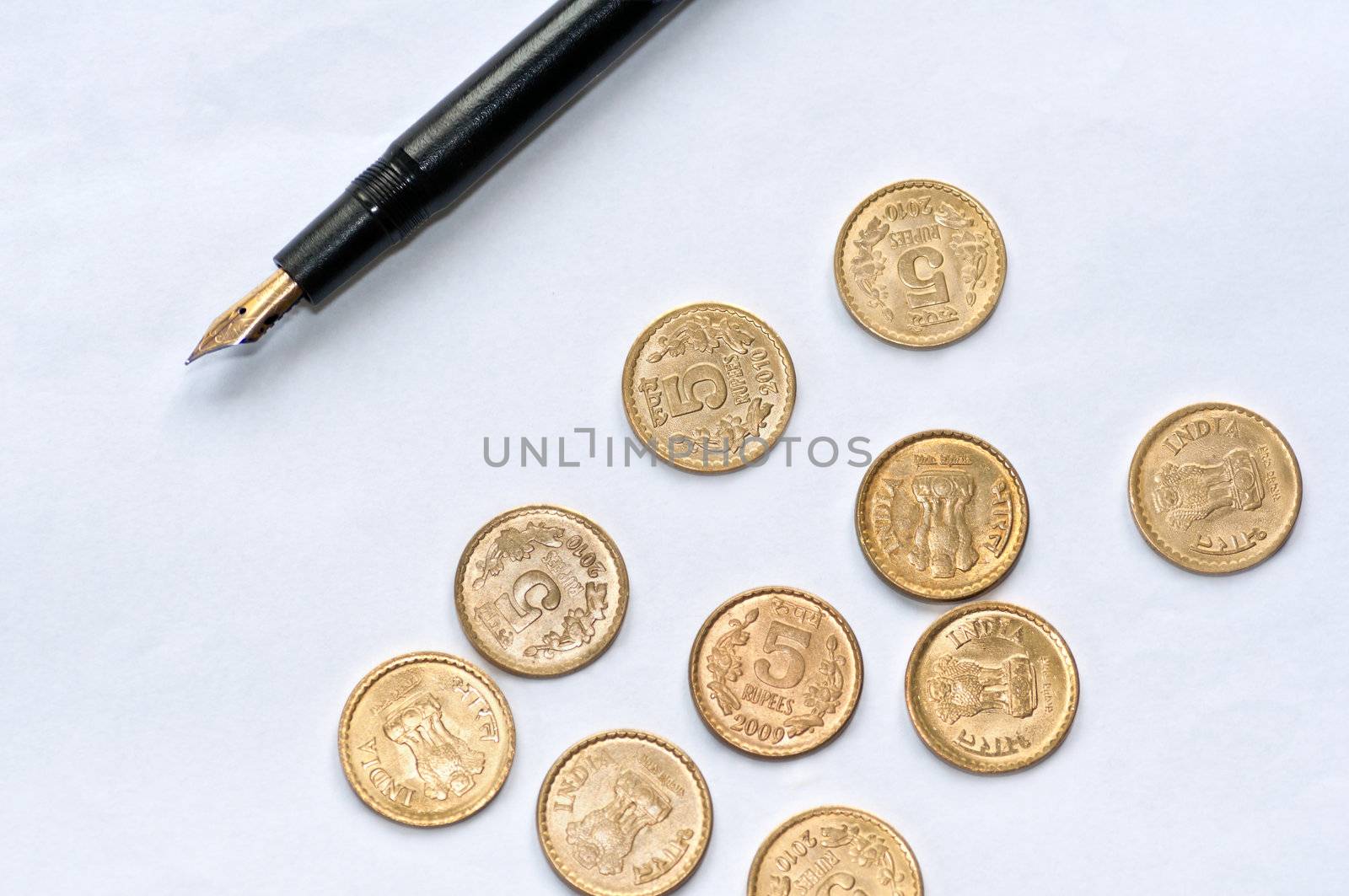 Closeup of  accounting, sheet of blank white paper, pen and coins, isolated, copy space