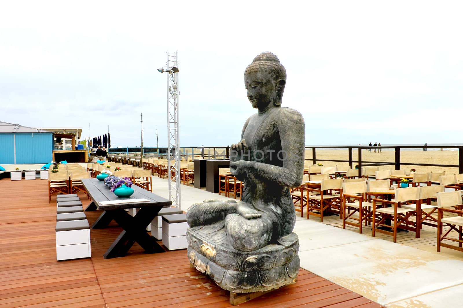 Spring on the coast. The statue in the outdoor cafe at The Hague by NickNick