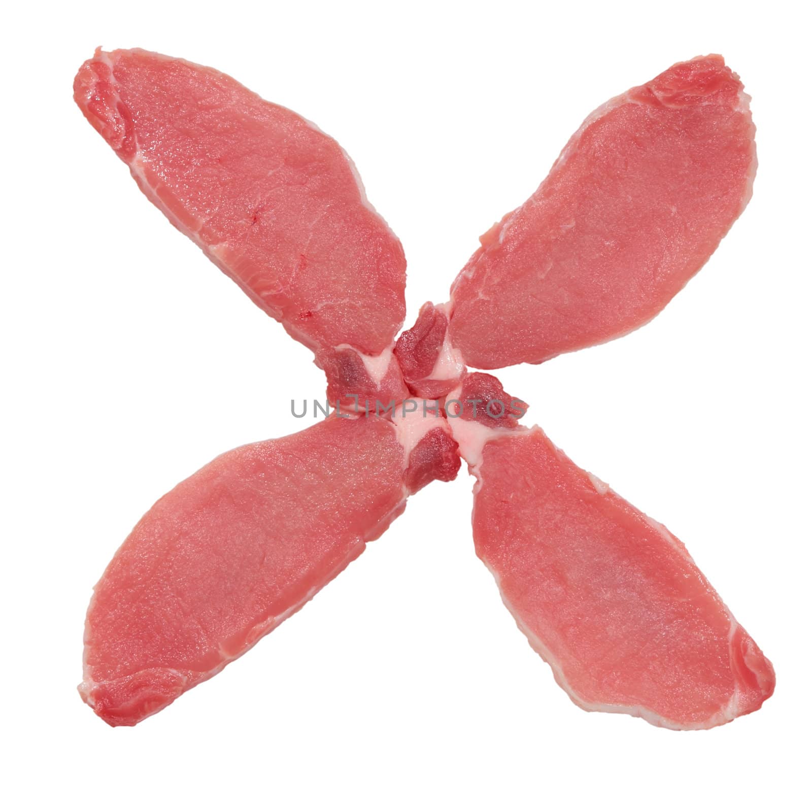 raw fillets of pork tenderloin placed in the form of a cross cut and isolated