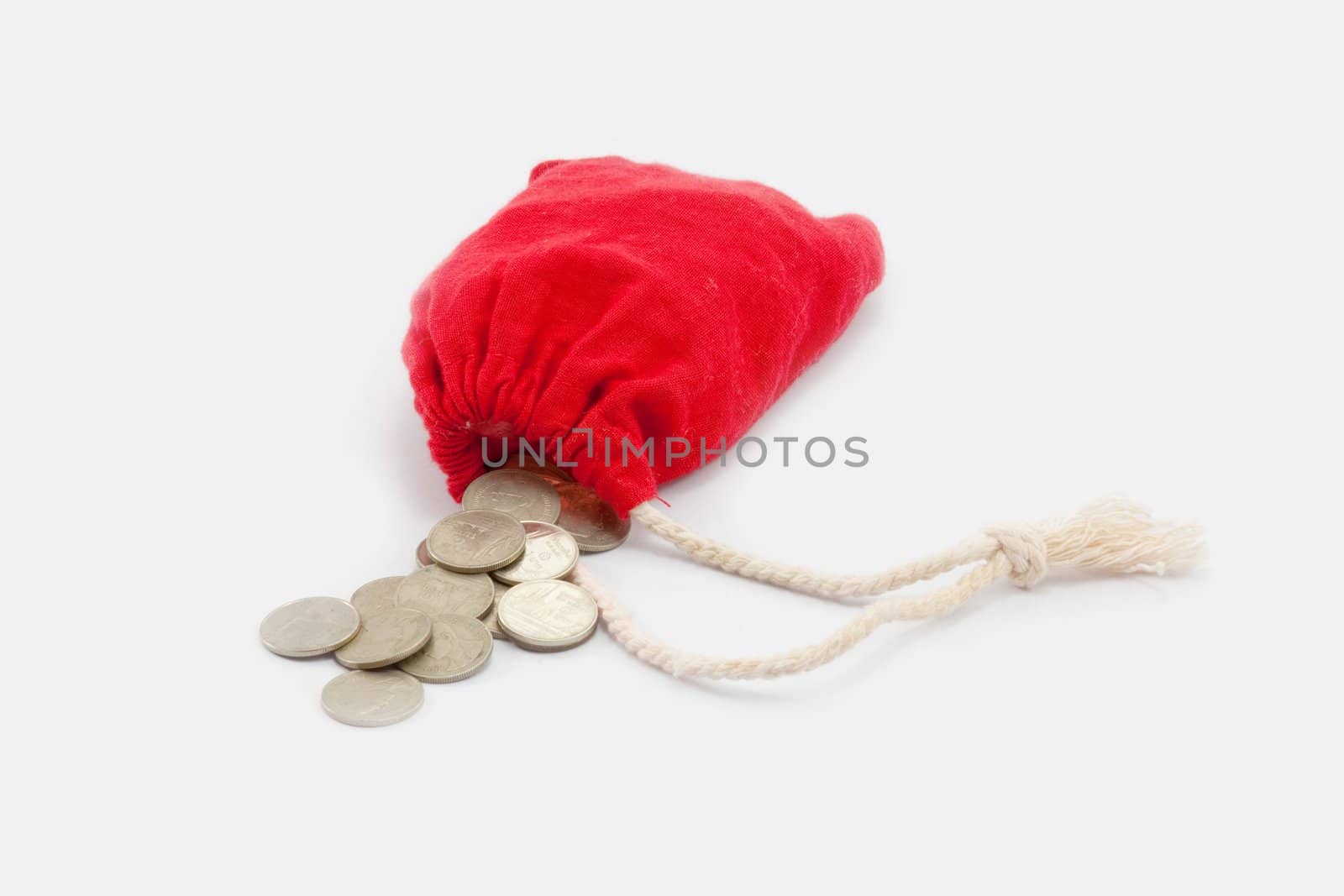 money bag with coins on a white background