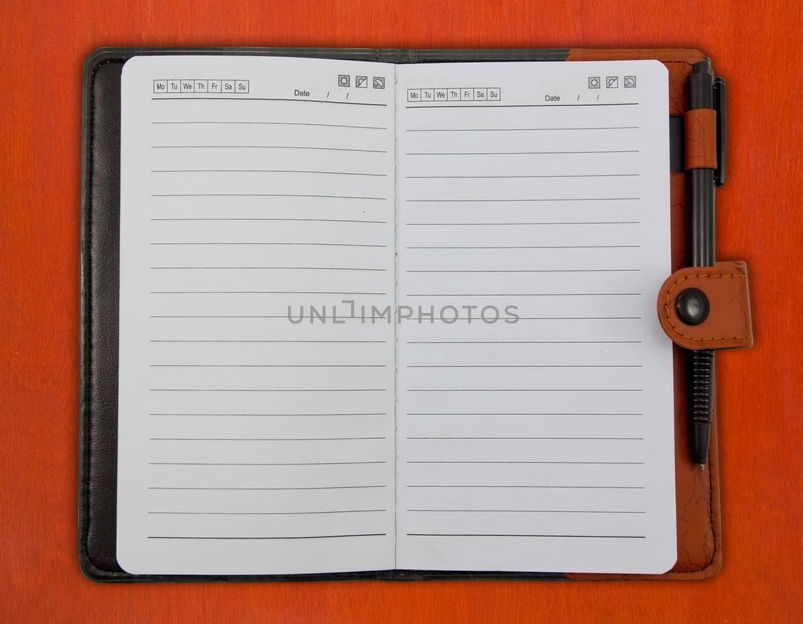 Brown Blank Note Book on wood background