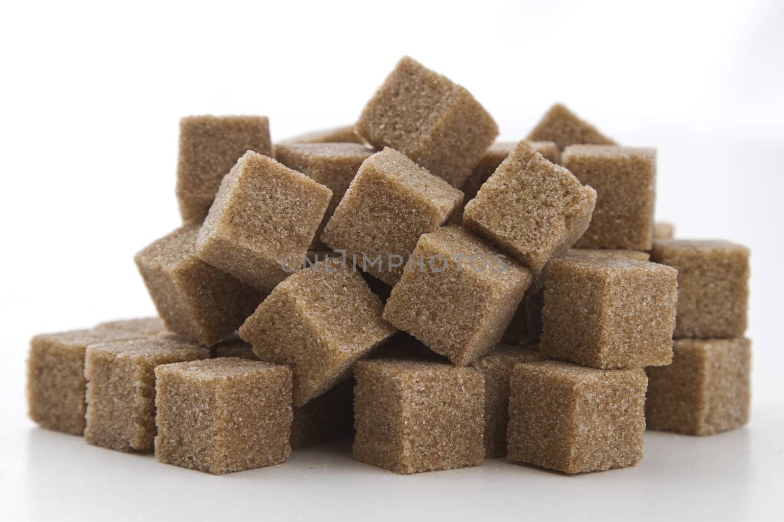 cubes of brown sugar stack in random fashion