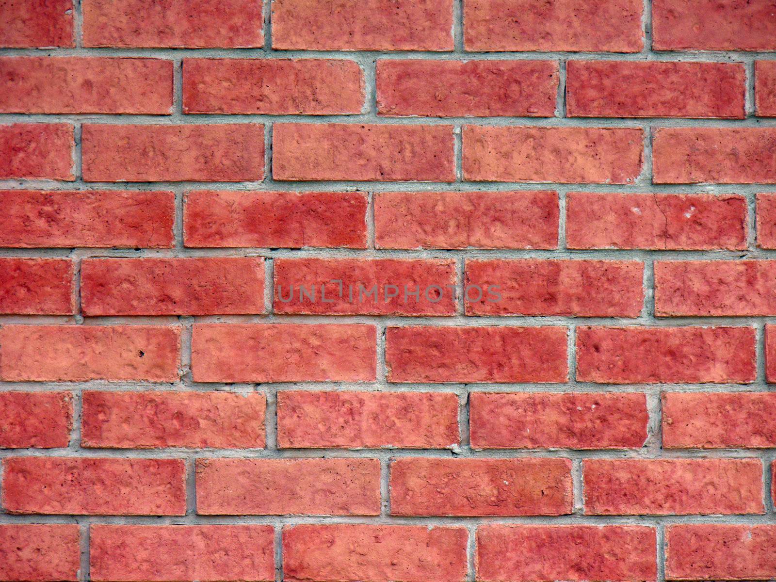 Brick wall from an old house by jconejo