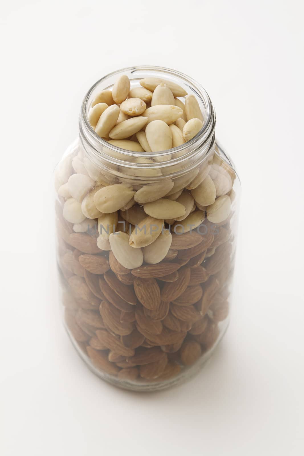 plain and peeled almond in a glass jar