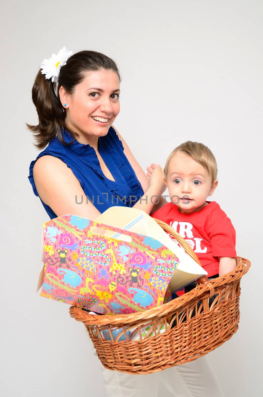 A beautiful woman coming from shopping with her little boy