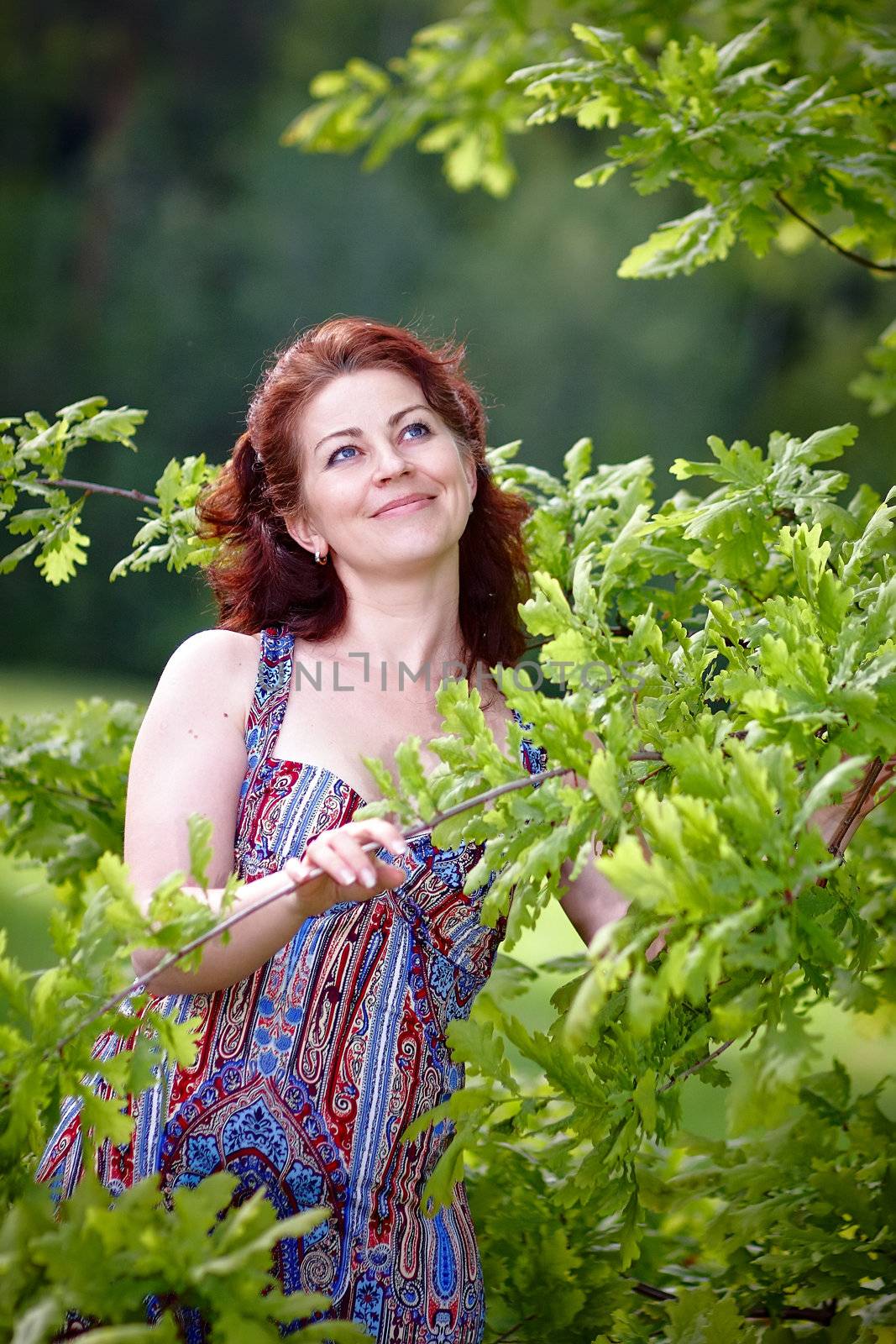 The beautiful woman with oak branches