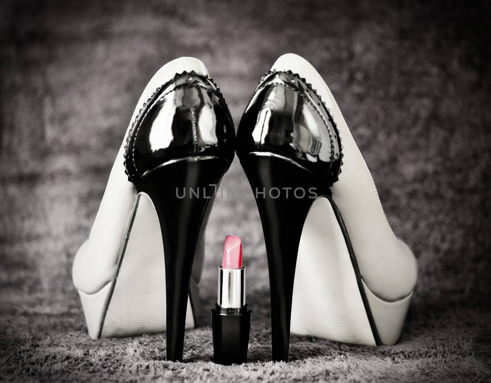 Women sexuality with tall shoes and red lipstick sitting between