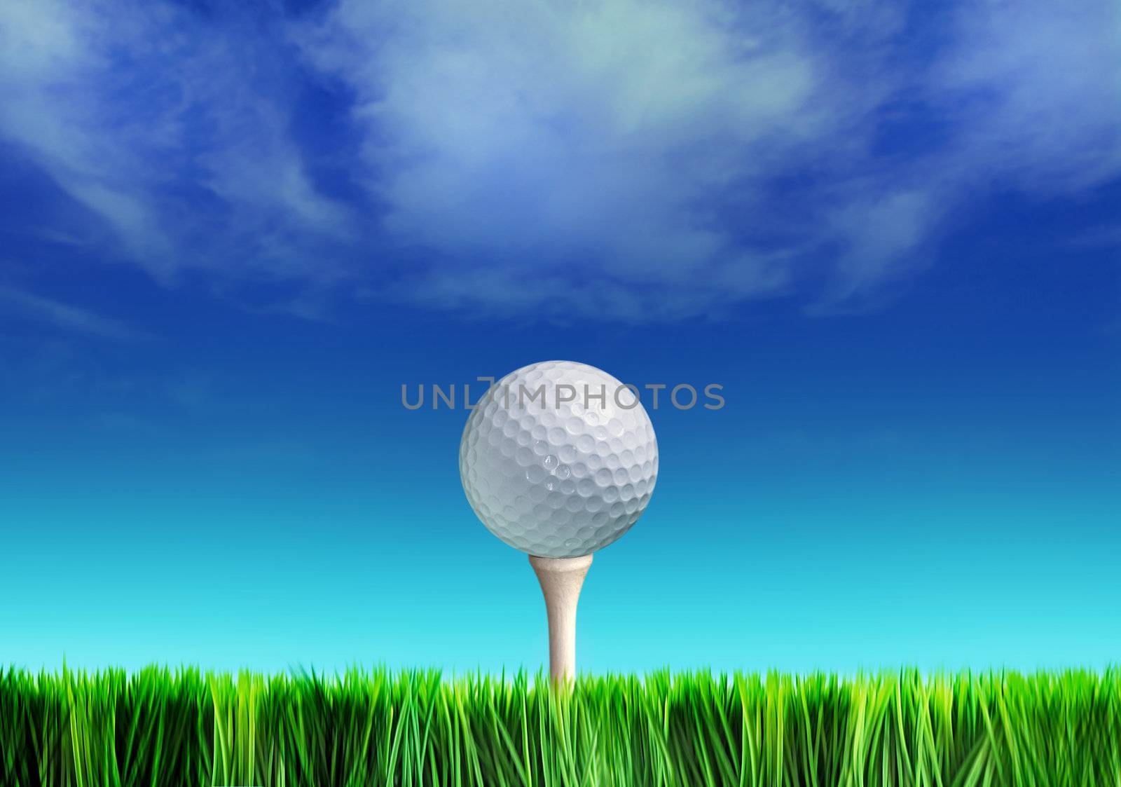 Golf ball on grass against blue sky and white clouds