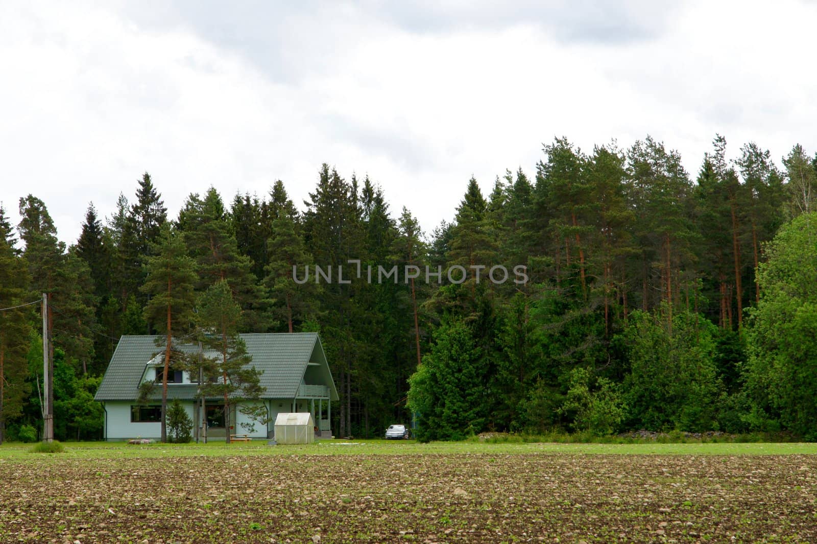 Modern apartment house on a background of a trees