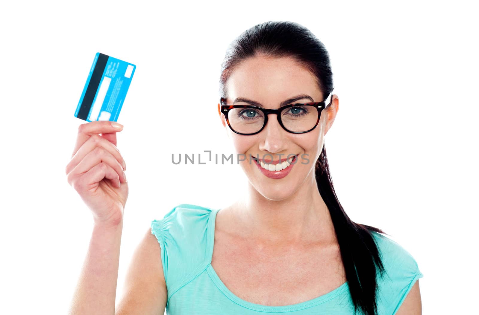 Close-up portrait of young smiling holding credit card isolated on white background