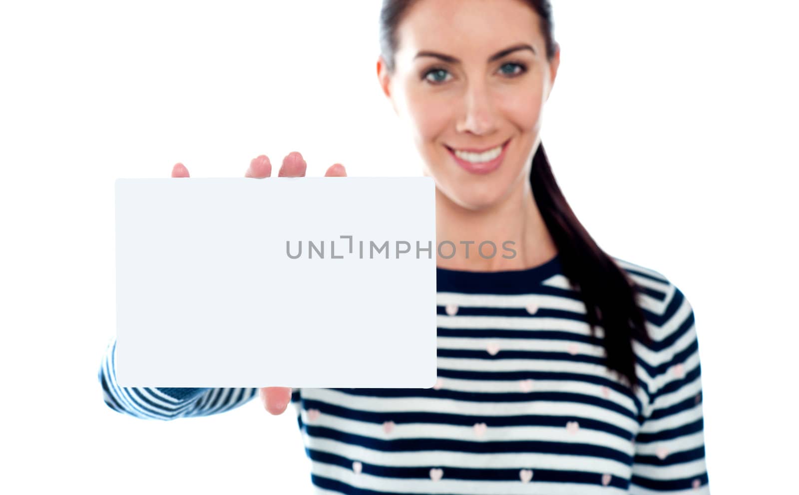 Beautiful girl holding blank card. Copyspace. All on white background