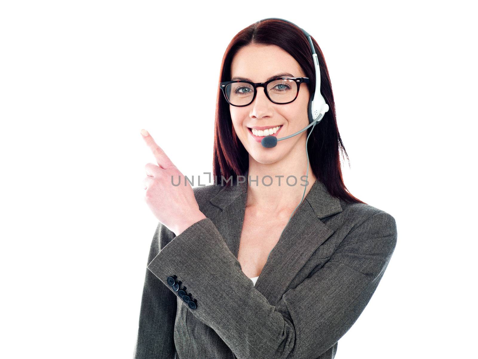 Customer support phone operator with headset pointing at something