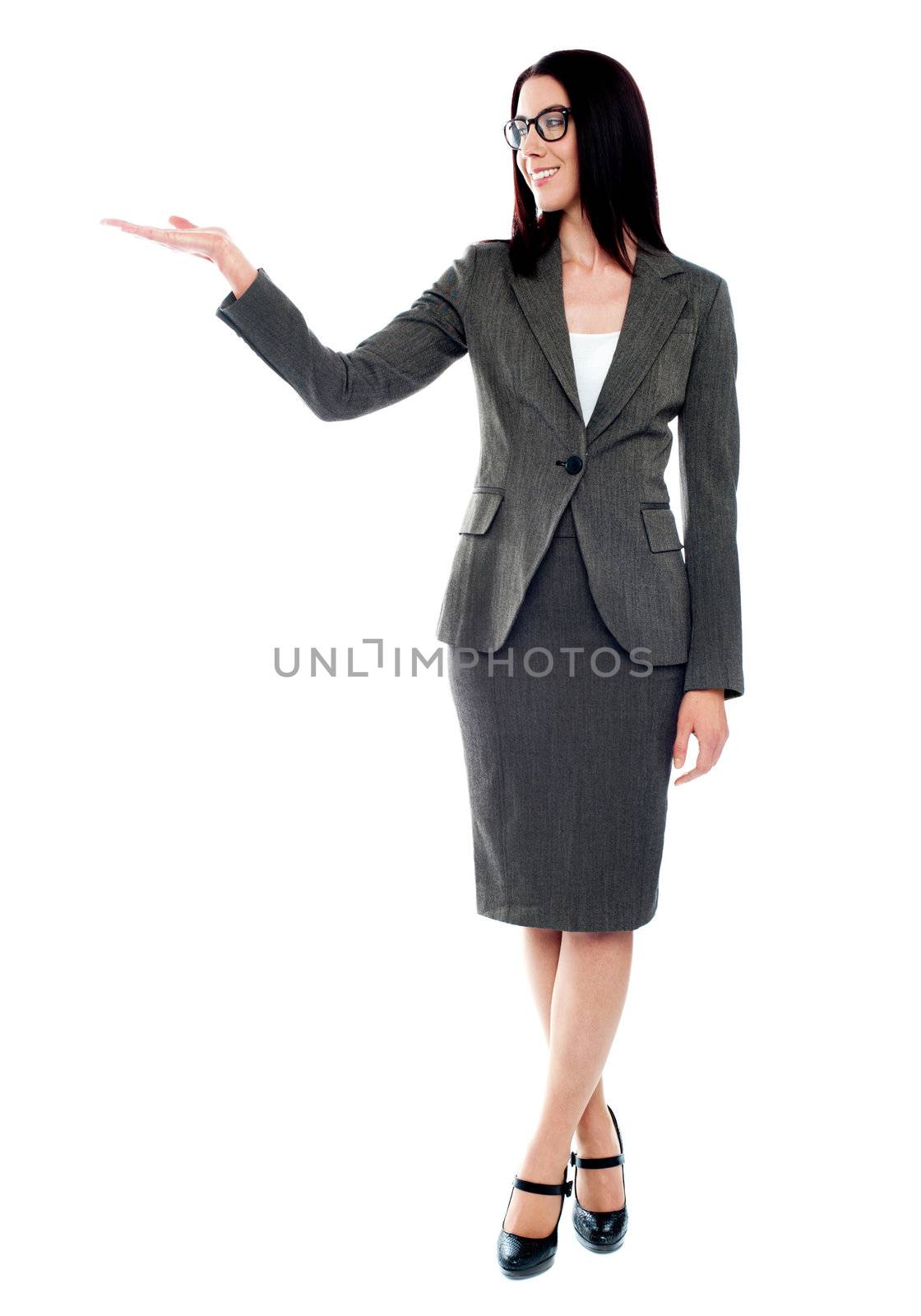 Full length of beautiful business woman showing copyspace up over white background