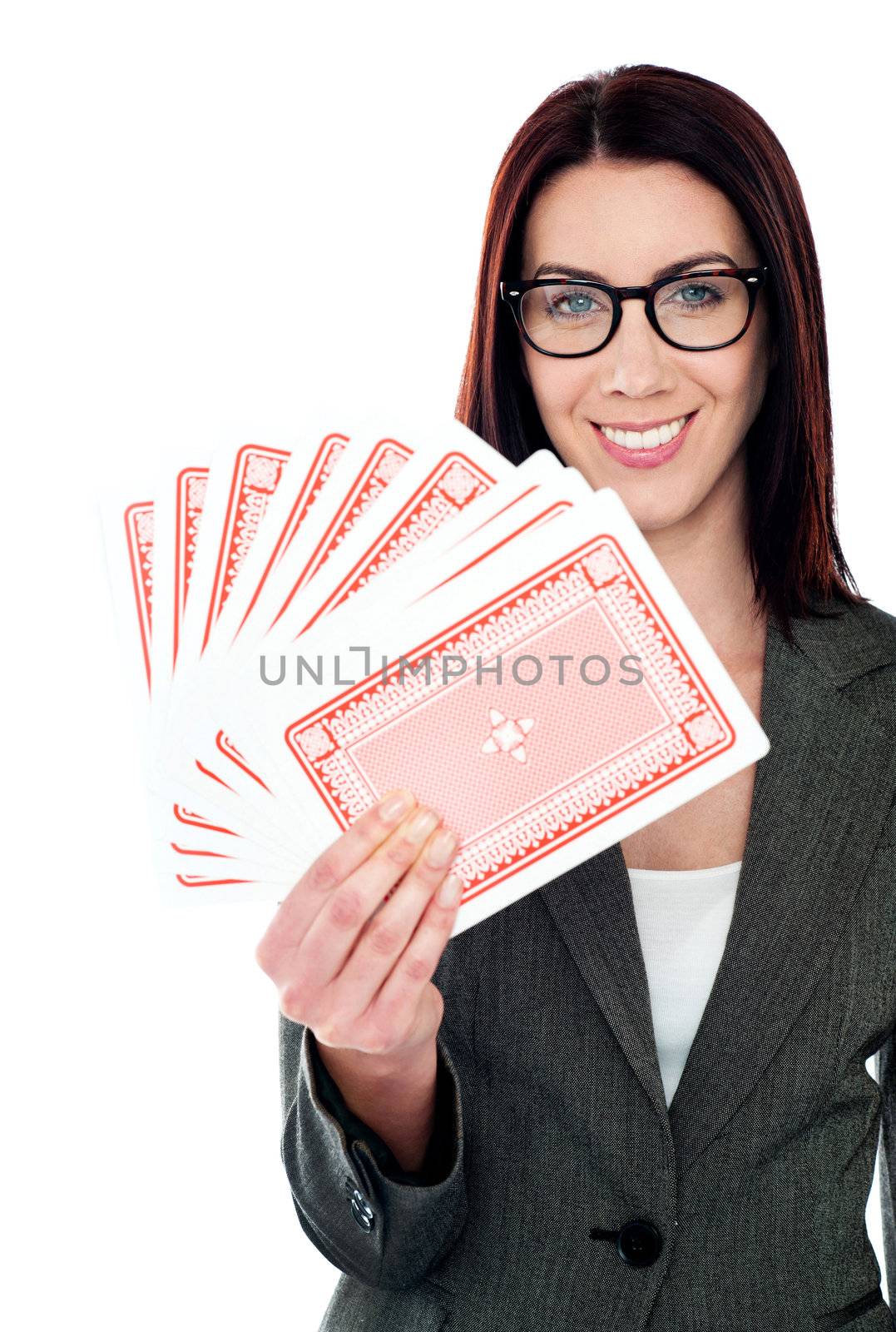 A beautiful woman holding playing cards trying her luck