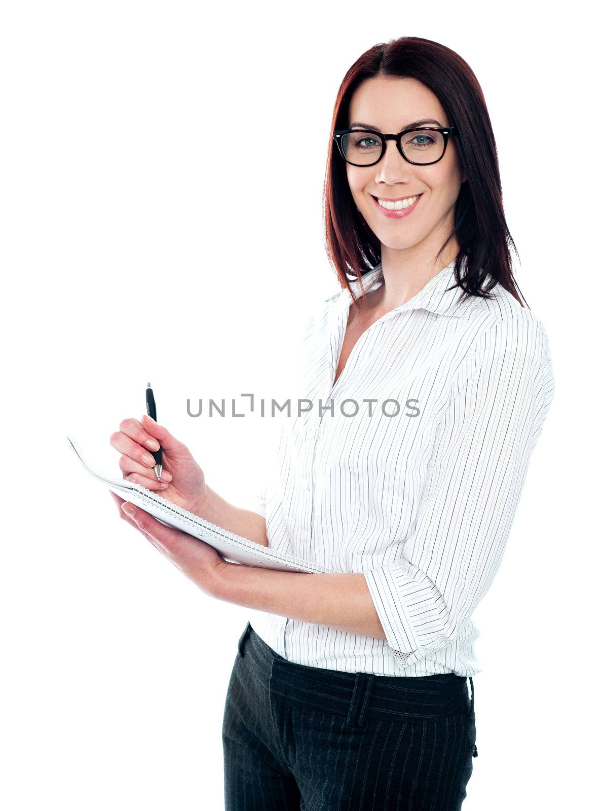 Smiling business woman writing on viral notedpad. Isolated against white background