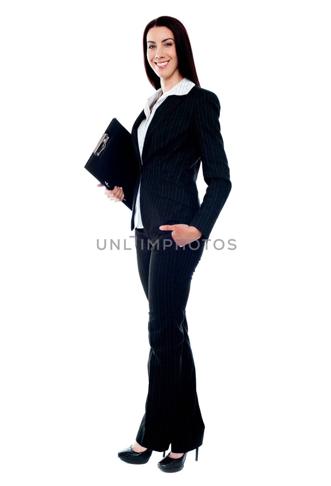 Full length of young businesswoman holding documents